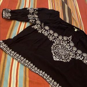 Black and white patterned blouse.